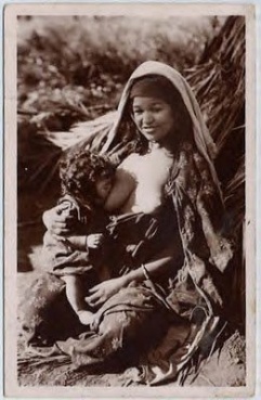 Date1925 DescriptionA young Arab mother feeding her child